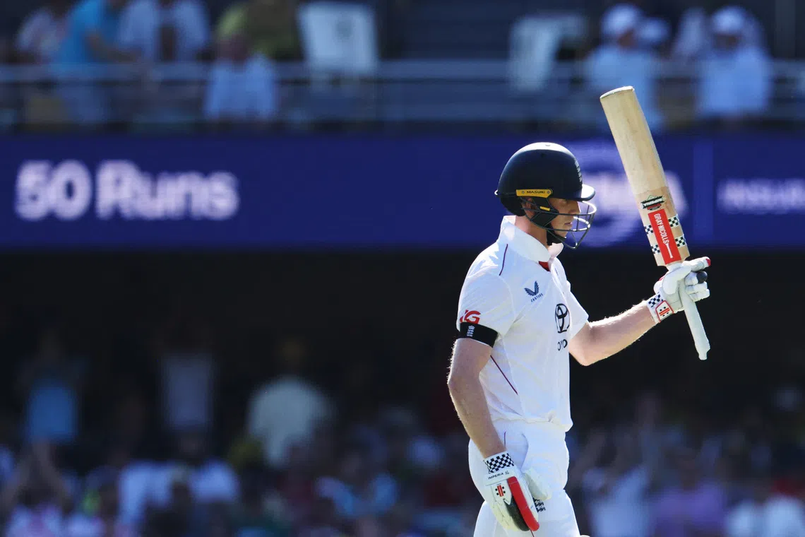 Cricket - The Ashes - Australia v England - Second Test - The Gabba, Brisbane, Australia - December 4, 2025 England's Zak Crawley celebrates after reaching his half century REUTERS/Hollie Adams