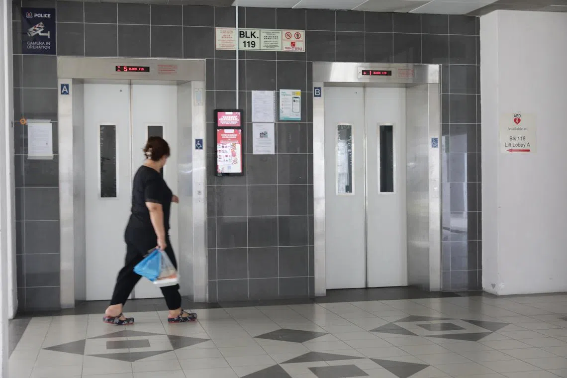 ST20230113_202343235921/yflift/Ryan Chiong
A resident of Block 119 Marsiling Rise at the lift landing.
Block 115 and Block 119 Marsiling Rise will undergo lift upgrading after 95 per cent of residents voted in favour of the project at the two Housing Board blocks. Currently, the lifts at the blocks stop only at the first, fifth, ninth and 12th storeys.