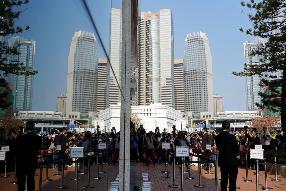 People arrive at the venue where an independent committee conducts evidential hearings for the deadly fire at Wang Fuk Court in Tai Po last November, in Hong Kong, China March 19, 2026. REUTERS/Joyce Zhou