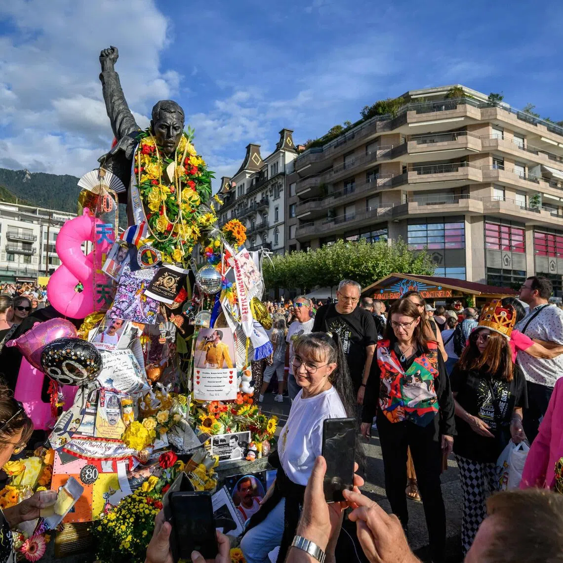 Fans gather around the iconic Freddie Mercury statue overlooking Lake Geneva during Montreux Freddie Day on Sept 5 in Montreux, Switzerland.