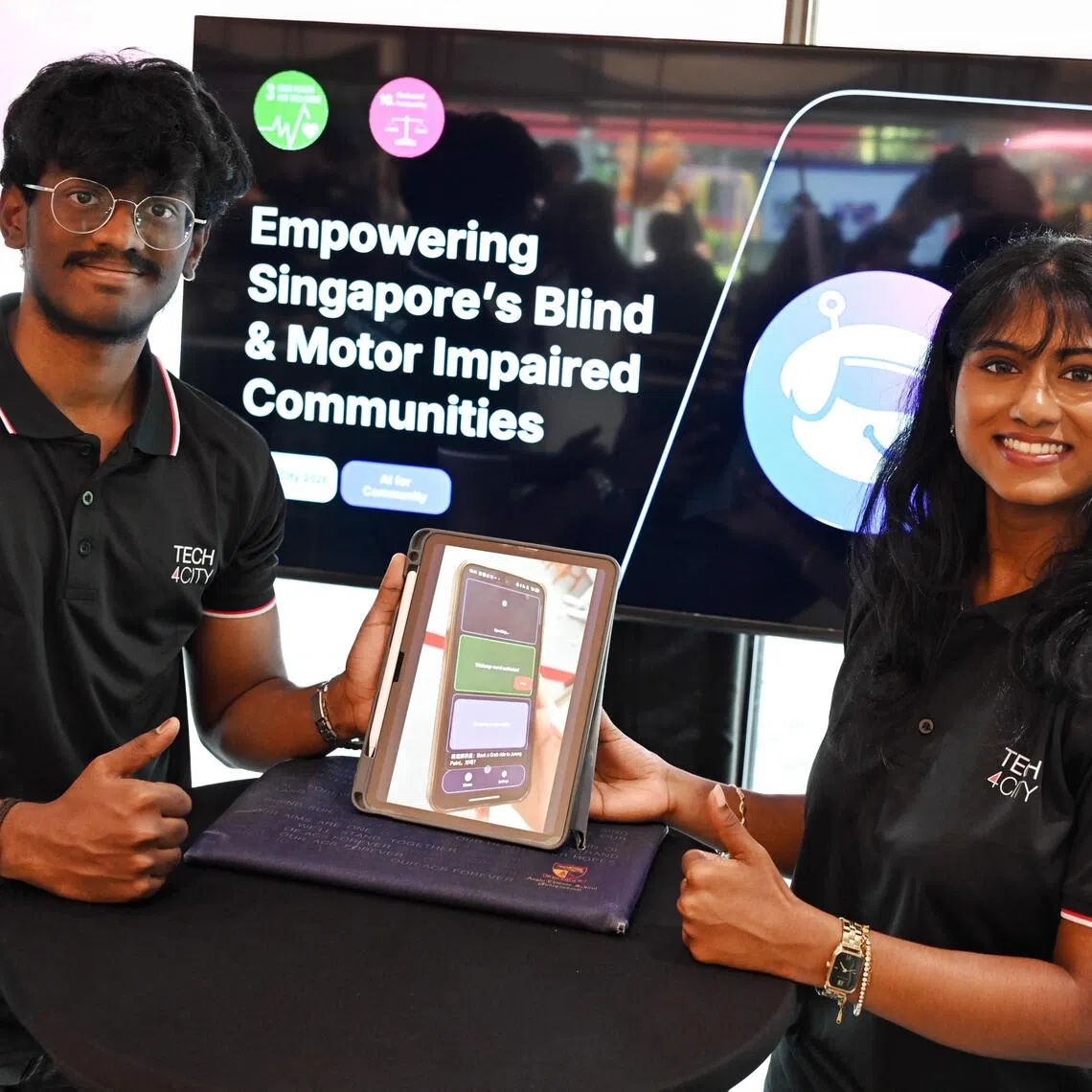 Members of the winning team, Sunday, from left, Senthilkumar Kunalkumar and Kumar Devadharshini, at the fifth Huawei Tech4City Competition finals, held at Launchpad@One-North on Oct 27.