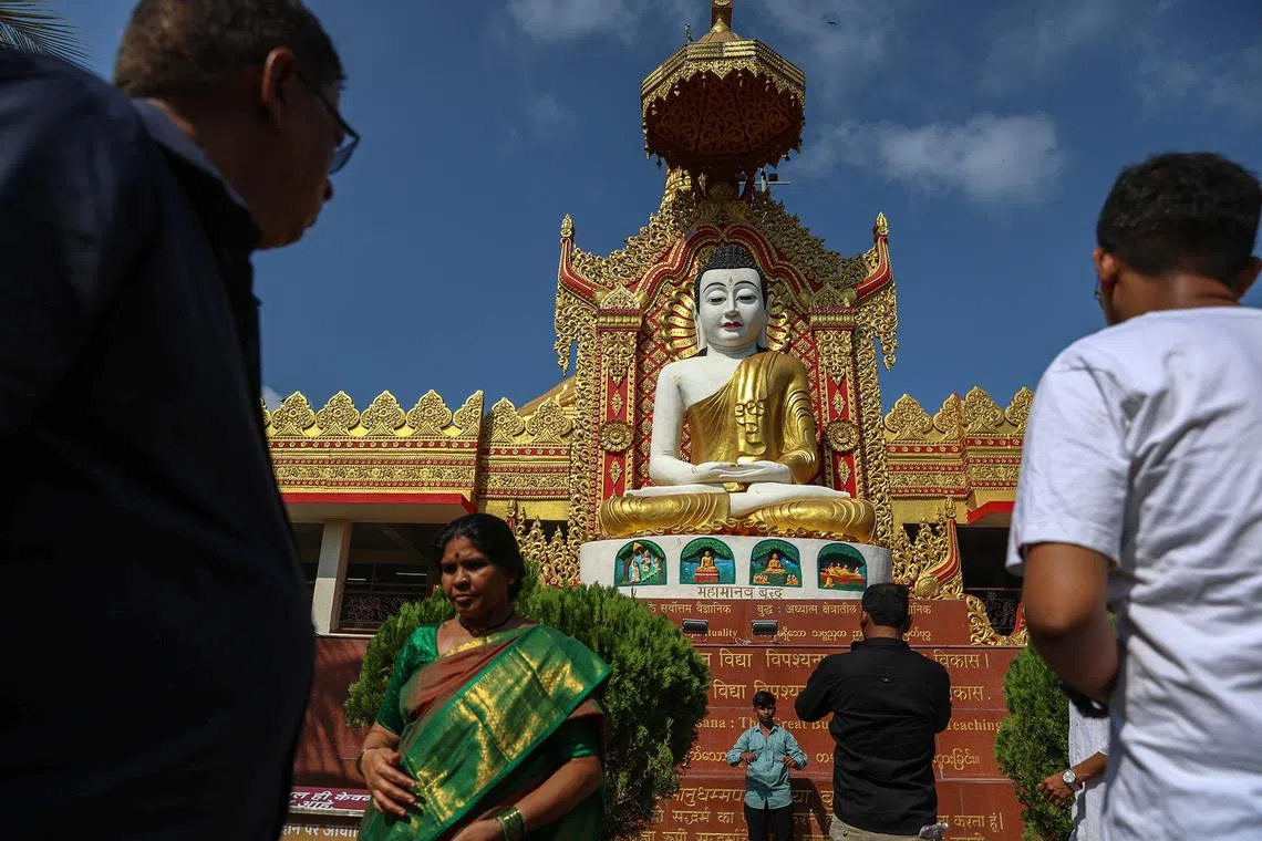 People visiting the statue of Gautama Buddha to offer prayers during the Buddha Jayanti, or Buddha Purnima, also known as Vesak Day, at the Global Vipassana Pagoda in Mumbai, India, on May 12, 2025. 