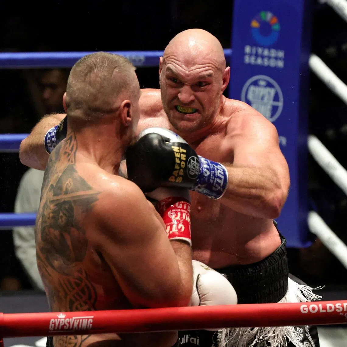 Tyson Fury punching Mariusz Wach on his way to victory in Pattaya, Thailand on July 24. He will face British rival Anthony Joshua for the first time professionally in a keenly watched bout.