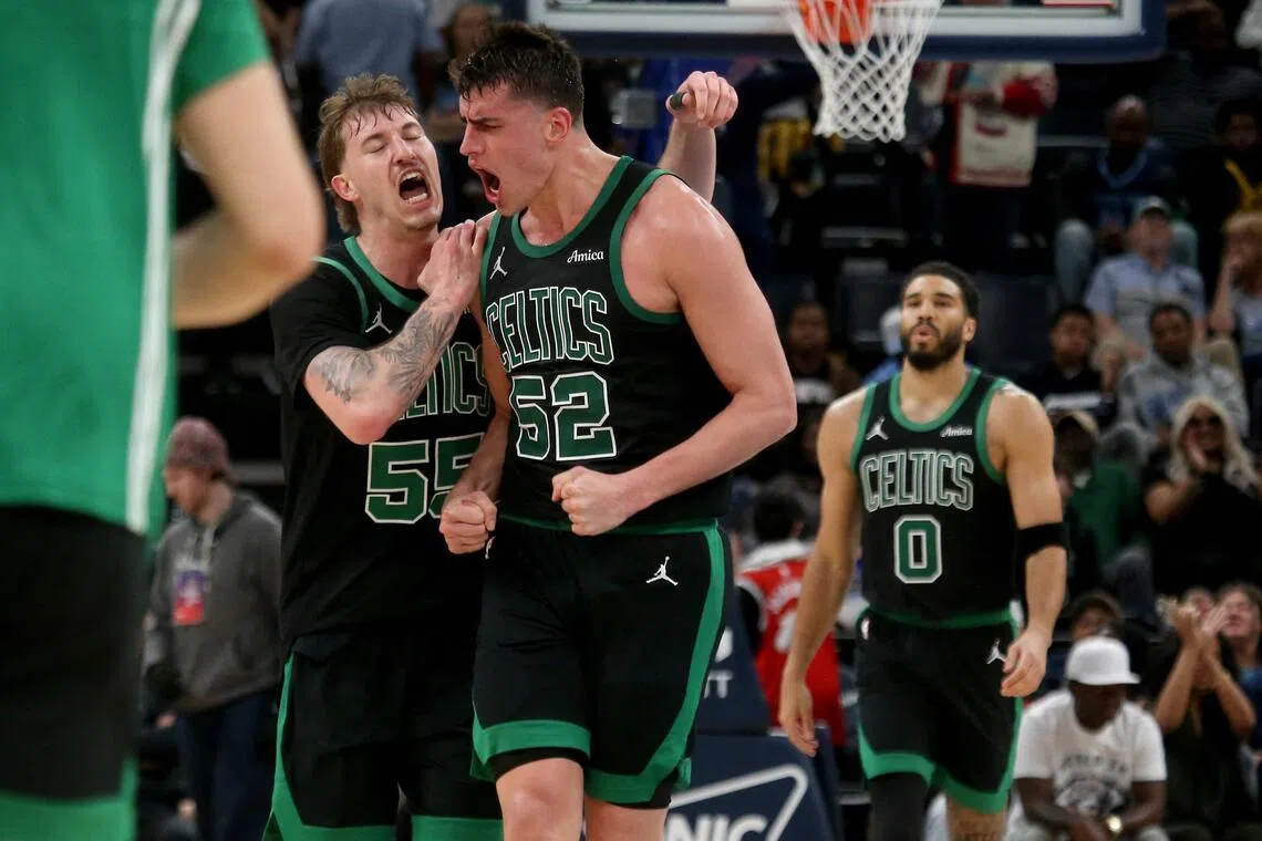 Boston Celtics guard Baylor Scheierman (left) and centre Luka Garza reacting during the 117-112 NBA victory over the Memphis Grizzlies on March 20 at FedExForum.