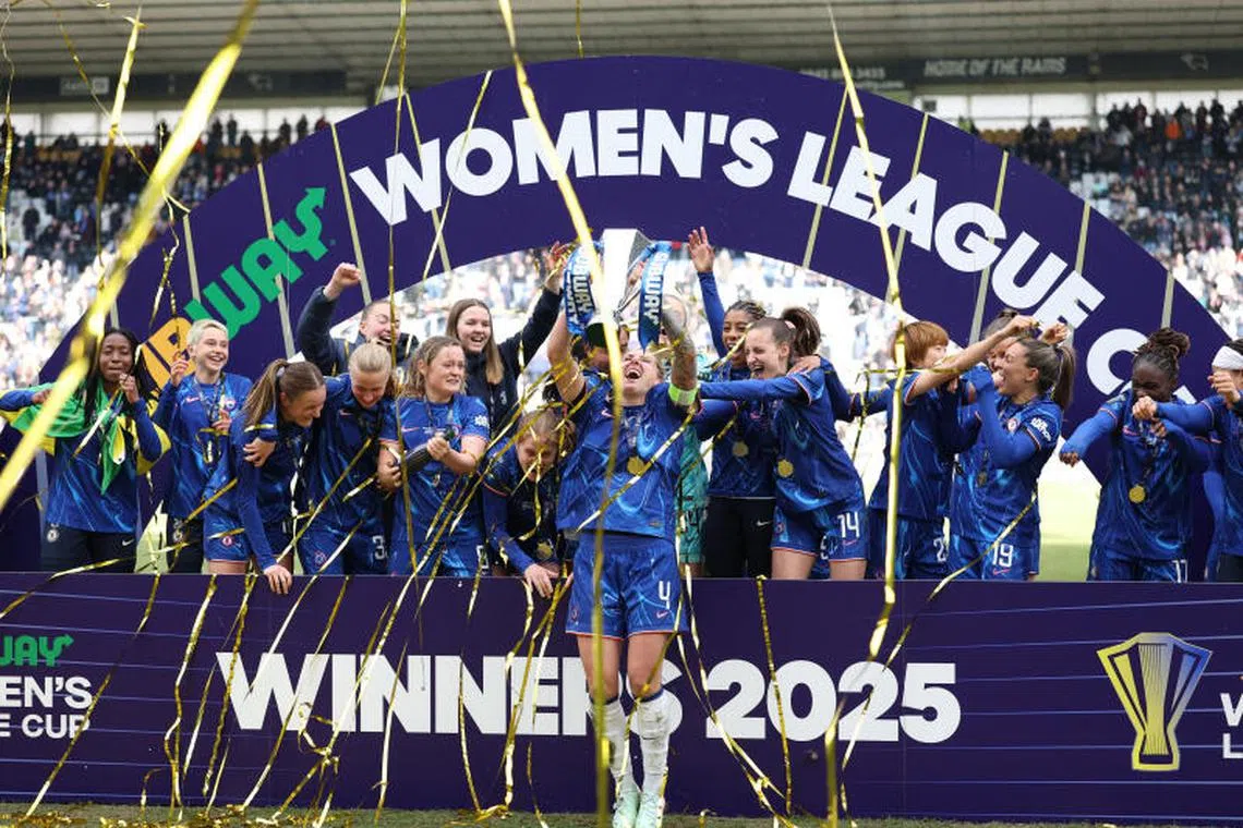 Soccer Football - Women's League Cup - Final - Chelsea v Manchester City - Pride Park, Derby, Britain - March 15, 2025 Chelsea's Millie Bright celebrates with teammates and the trophy after winning the Women's League Cup Action Images via Reuters/John Sibley