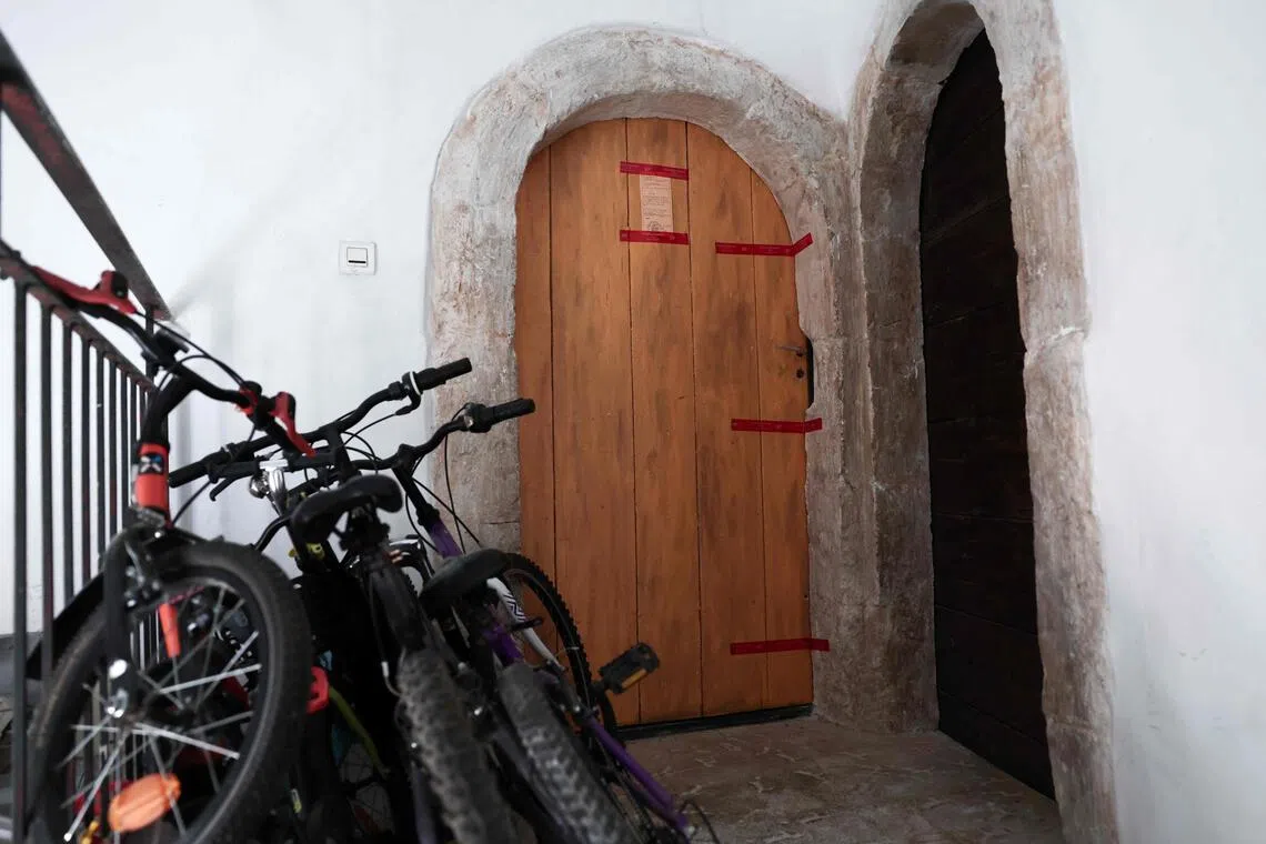 French police seals affixed to the door of an apartment in Orange, south-eastern France, on July 28, after the bodies of five deceased infants were discovered.