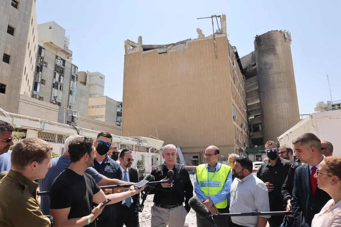 Mr Netanyahu (middle) said everyone bear a personal cost due to the ongoing conflict, including his family. 