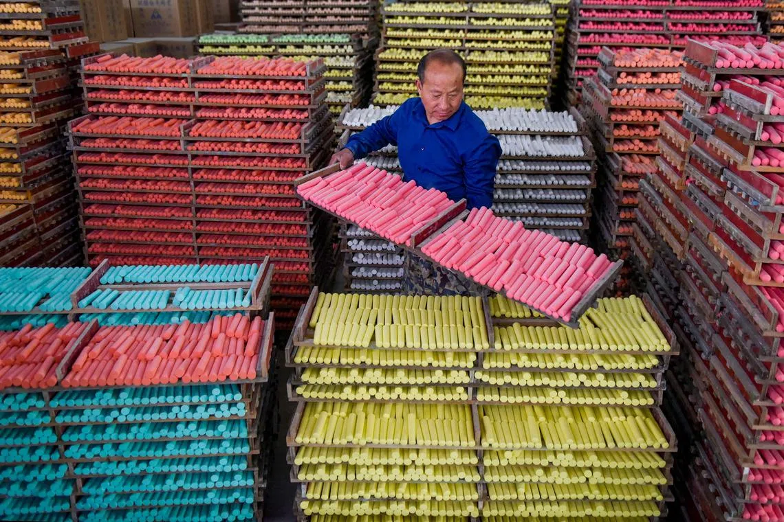 A worker producing chalks at a workshop in Yingcheng, Xiaogan city, in China's central Hubei province. on May 2, 2023. 