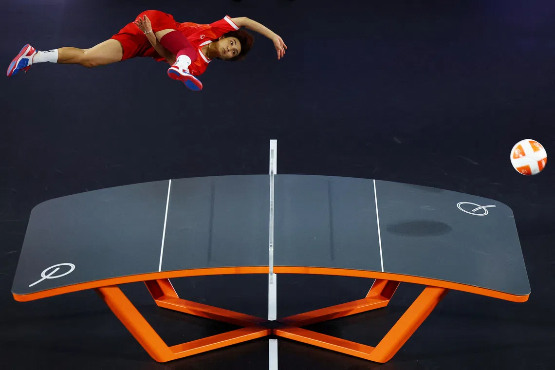 Asian Games - Aichi-Nagoya 2026 - Teqball - Higashi Sports Center, Nagoya, Japan - September 20, 2026 Thailand's Suphawadi Wongkhamchan in action with Jutatip Kuntatong during their women's doubles final against Myanmar's Aung Hsu Mon and Than Phyu Phyu REUTERS/Issei Kato TPX IMAGES OF THE DAY