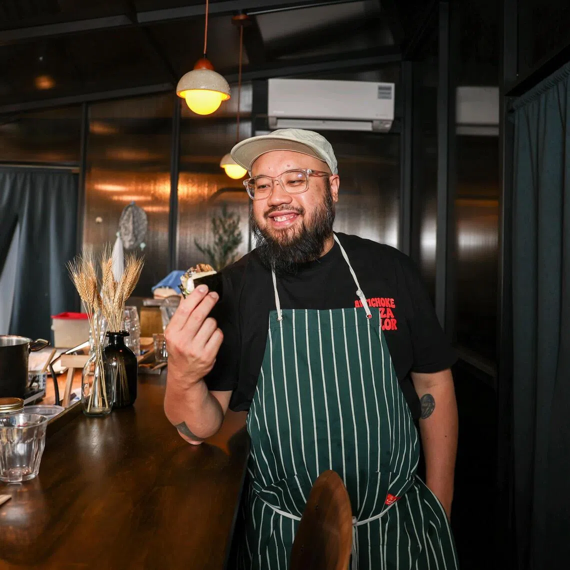 Chef Bjorn Shen serves bread "sushi" at his new restaurant, Jellyfish Sushi. 