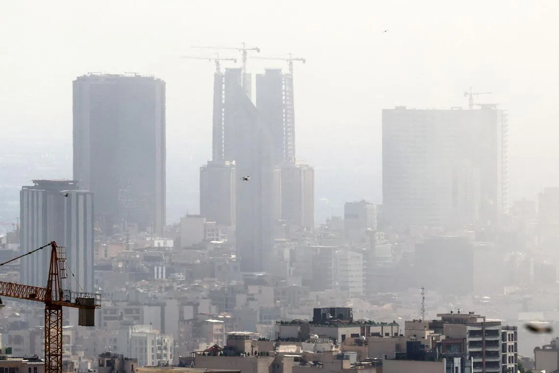 Smoke lingers in the sky above Tehran following an Israeli strike on June 18.