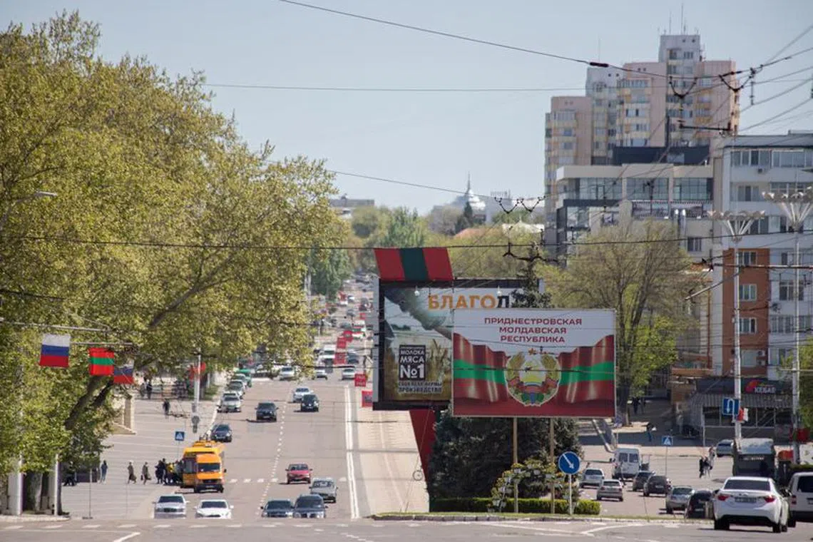 FILE PHOTO: The coat of arms of Transdniestria is depicted on a banner in central Tiraspol, in Moldova's breakaway region of Transdniestria May 5, 2022. REUTERS/Vladislav Bachev/File Photo