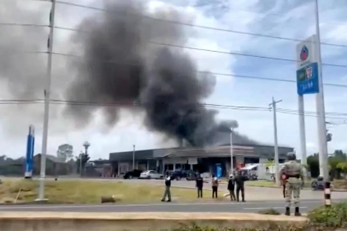 Smoke rises from a convenience store at a gas station, amid the clashes between Thailand and Cambodia, in Kantharalak district in Thailand on July 24, 2025.