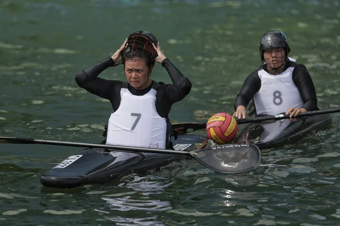 Singapore canoe polo player Gracie Chua (left) during training at Marina Bay Waterfront Promenade on Tuesday. The Republic is hosting this week's Asian Canoe Polo Championships.