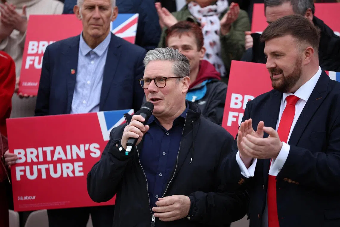 Britain's opposition Labour Party leader Keir Starmer speaks next to Labour Party MP for Blackpool South Chris Webb after Labour won a parliamentary by-election in Blackpool, Britain on May 3, 2024.