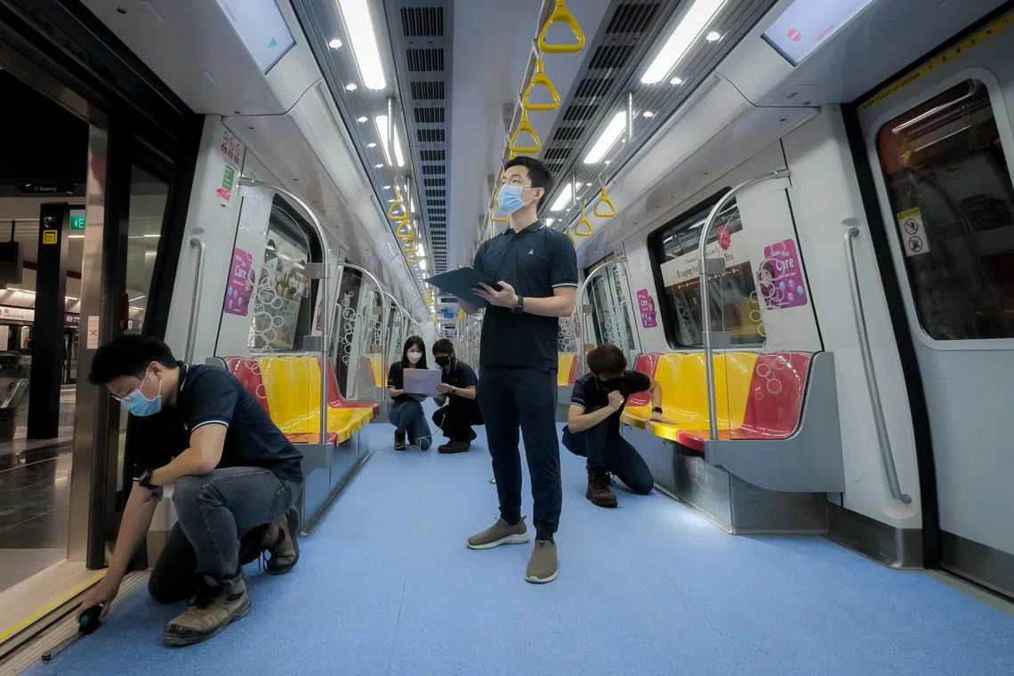 Land Transport Authority project engineers inspecting a train at Napier MRT station on Nov 3, 2022, ahead of the opening of the third stage of the Thomson-East Coast Line.