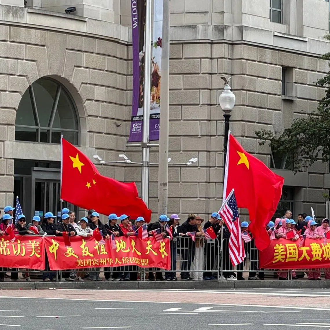 People gathering near the Waldorf Astoria hotel in Washington, where Chinese President Xi Jinping is staying during his three-day state visit to the US, on Sept 23.