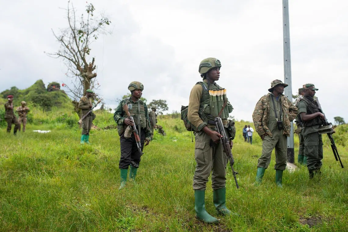 FILE PHOTO: Congolese M23 rebels are seen as before they withdraw from the 3 antennes location in Kibumba, near Goma, North Kivu province of the Democratic Republic of Congo, December 23, 2022. REUTERS/Arlette Bashizi/File Photo
