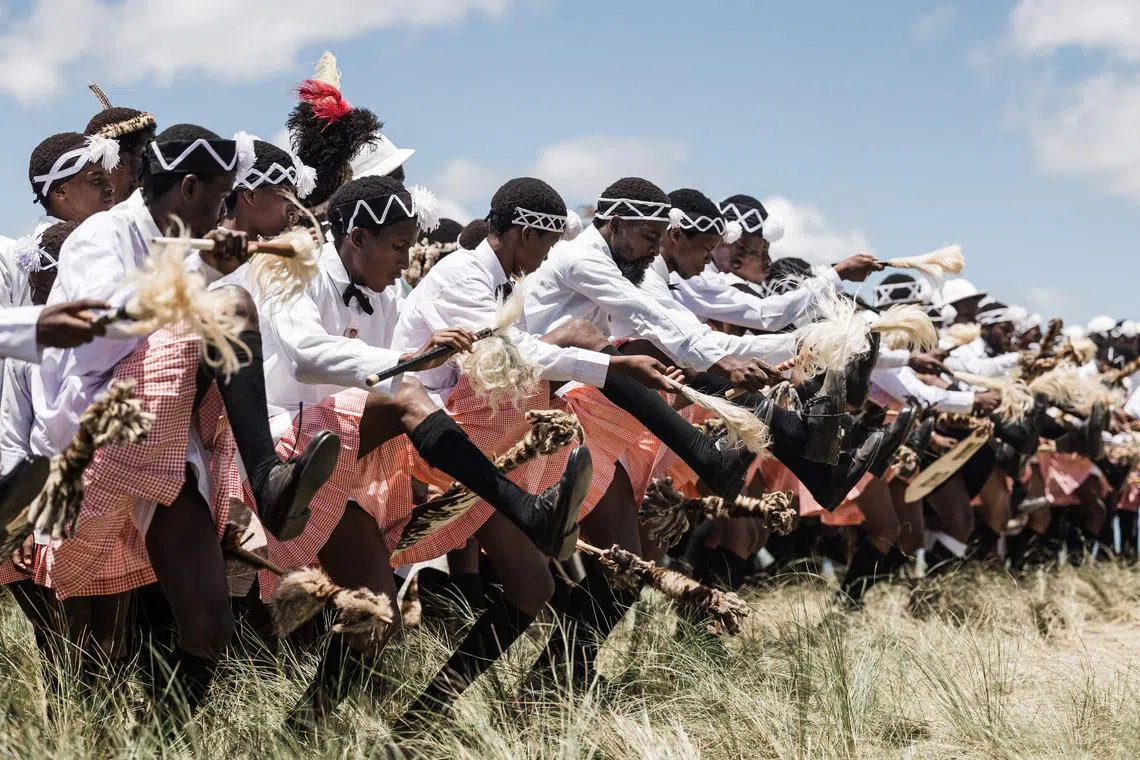 Followers of the Nazareth Baptist Church, from the Ekuphakameni group, also known as the Shembe Church, dressed in traditional attire, take part in a cultural dance on the Nhlangakazi Holy Mountain in Ndwedwe 85km north of Durban, on Jan 8, 2023.