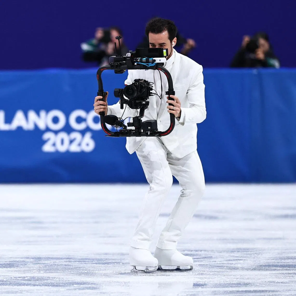 Milano Cortina 2026 Olympics - Figure Skating - Women Single Skating - Short Program - Milano Ice Skating Arena, Milan, Italy - February 17, 2026. Camera operator and former ice dancer Jordan Cowan during the Short Program REUTERS/Amanda Perobelli