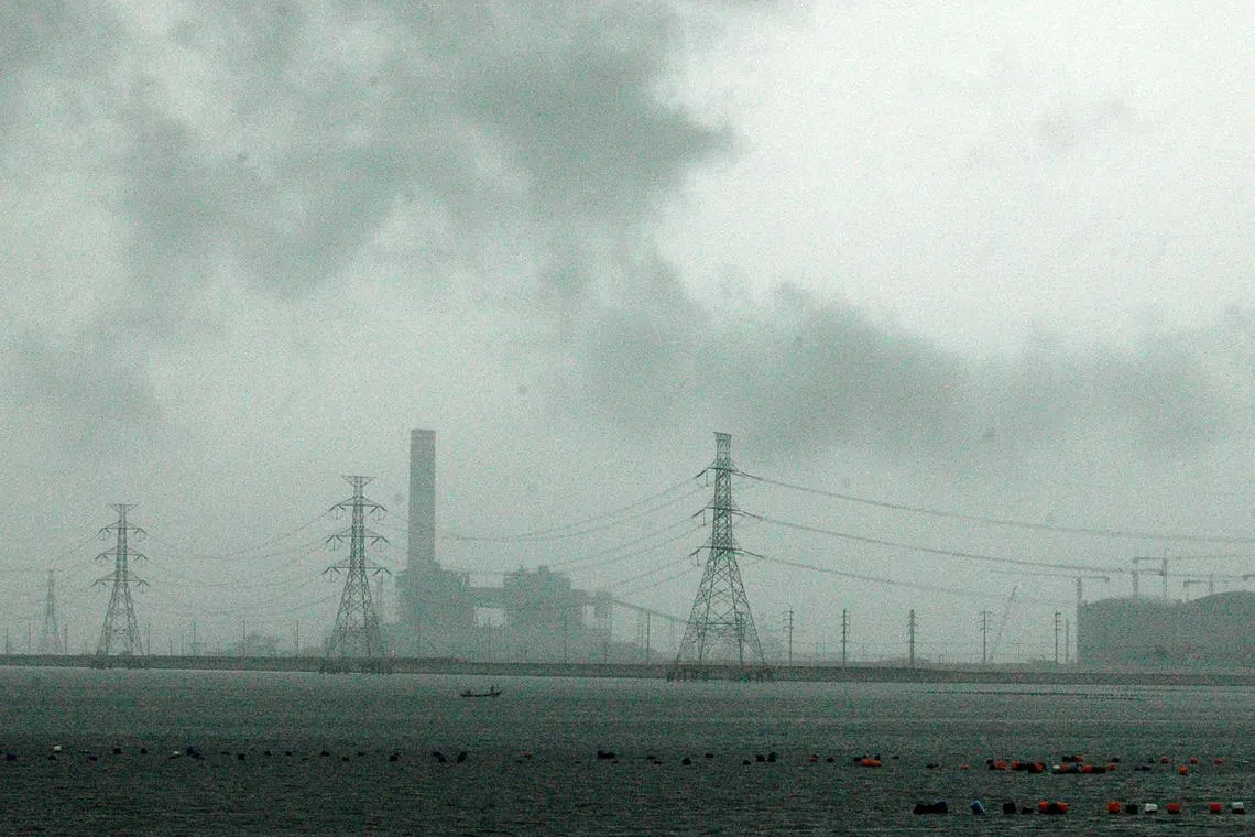 A power plant in Rayong, where the landscape has been transformed into an industrial heartland.  In all, there are over 100 industrial plants in a 16.5 sq km area in the coastal province of Rayong in Thailand.