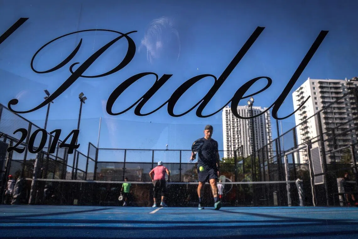 People play padel on a court in Miami, Florida, on March 22, 2026. Padel, the racket sport that originated among the elites of Latin America and Spain, has exploded in popularity in Miami. Fans say it will conquer the rest of the United States, and the world.