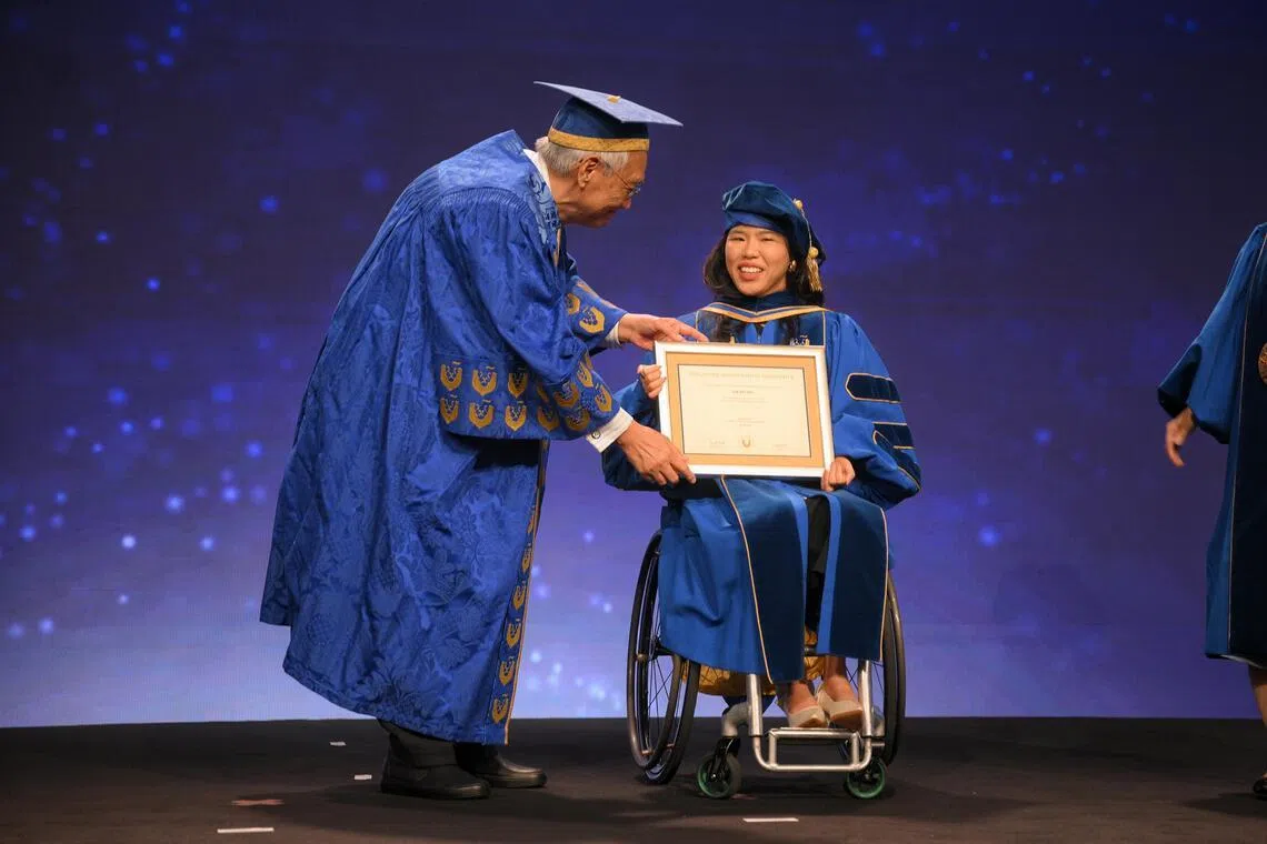 Singapore Management University (SMU) Chancellor Lim Chee Onn presents the Honorary Doctor of Laws degree to Yip Pin Xiu at SMU on July 28, 2026.