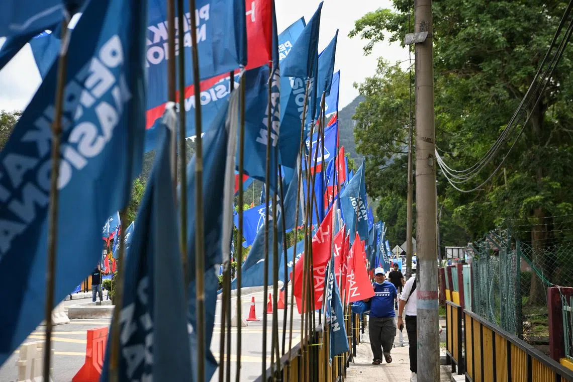 Party flags hung up at the street entering the nomination centre in Gombak on Nov 5, 2022.



/Nomination centre at Sekolah Menengah Kebangsaan Sungai Pusu, where former political friends-turned-bitter rivals caretaker International Minister Azmin Ali and Selangor Menteri Besar Amirudin Shari will contest for the same parliamentary seat in the Selangor state