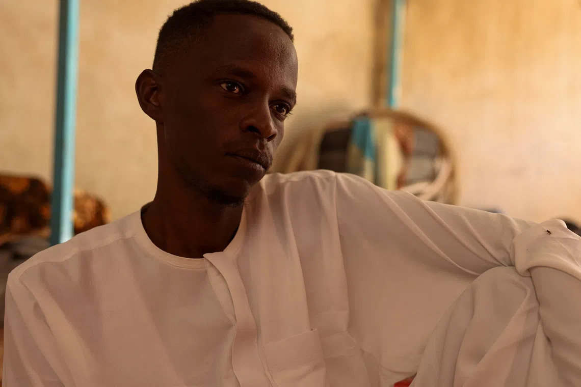 Ibrahim Kitr, 30, a Sudanese refugee from al-Fashir who was held captive for two days by the paramilitary Rapid Support Forces (RSF) in northeast al-Fashir after the city was captured, until his family paid 35 million Sudanese pounds for his release, looks on during an interview with Reuters in Tine, eastern Chad, November 24, 2025. REUTERS/Amr Abdallah Dalsh