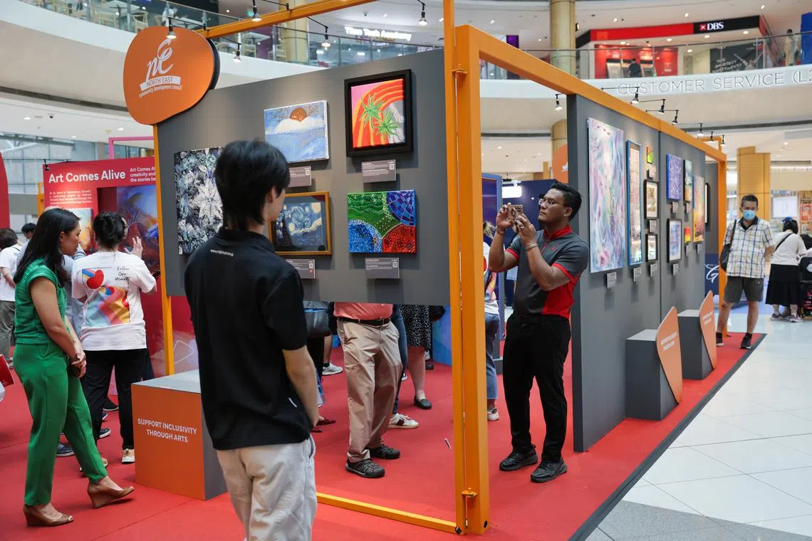 Visitors at the Shaping Hearts Roving Exhibition in Suntec City, on Sept 24.