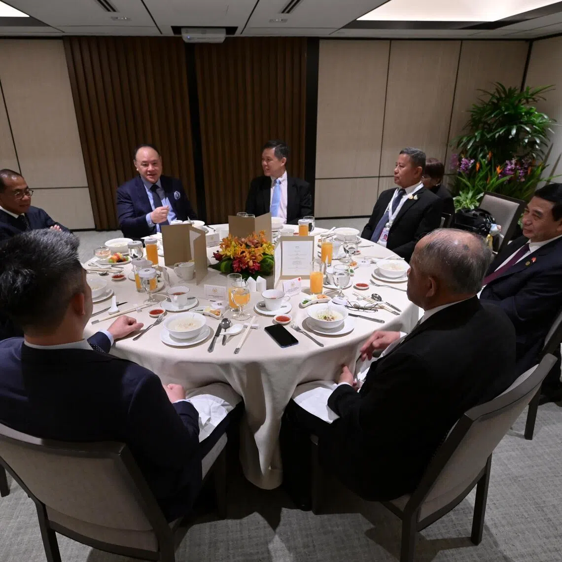 Defence Minister Chan Chun Sing and the Philippines’ Secretary of National Defence, Mr Gilberto Teodoro Jr. (left), having breakfast with other ASEAN defence ministers on May 30.
(Clockwise from centre) Defence Minister Chan Chun Sing, Thai Defence Minister Adul Boonthamcharoen, Vietnam's Deputy Prime Minister and National Defence Minister Phan Van Giang, Brunei's Minister at the Prime Minister’s Office and Minister of Defence II Dato Paduka Seri Haji Awang Halbi Bin Haji Mohd Yussof, Cambodia's Secretary of State at the Ministry of National Defence Rath Dararoth, Indonesia's Vice-Minister of Defence Donny Ermawan Taufanto, Malaysian Defence Minister Mohamed Khaled Nordin and the Philippines' Secretary of National Defence Gilberto Teodoro Jr. having breakfast on May 30.