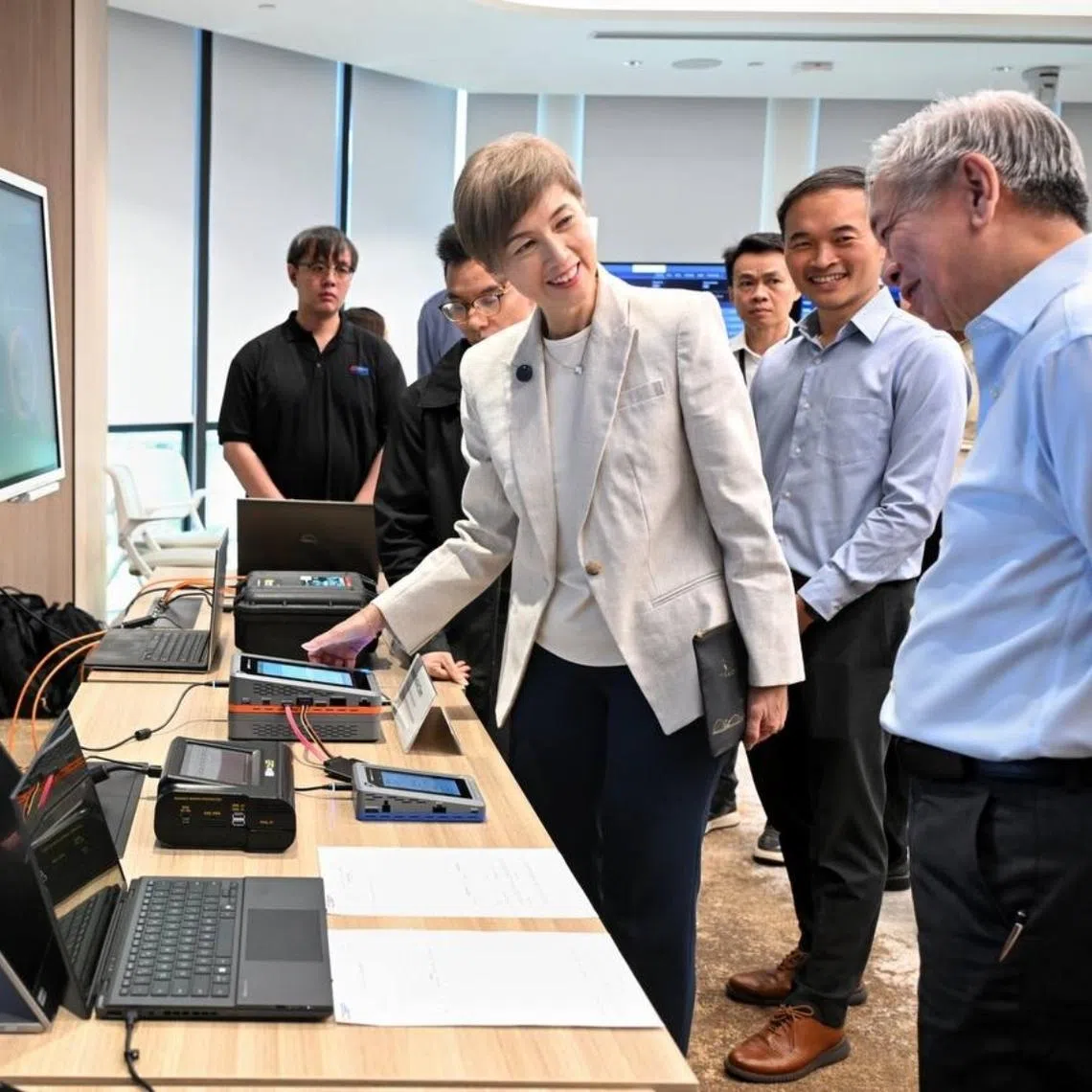 MDDI Minister Josephine Teo (third from left) and CSA chief executive David Koh (left) viewing the technical demonstration at an engagement event for cyber defenders on Feb 9.