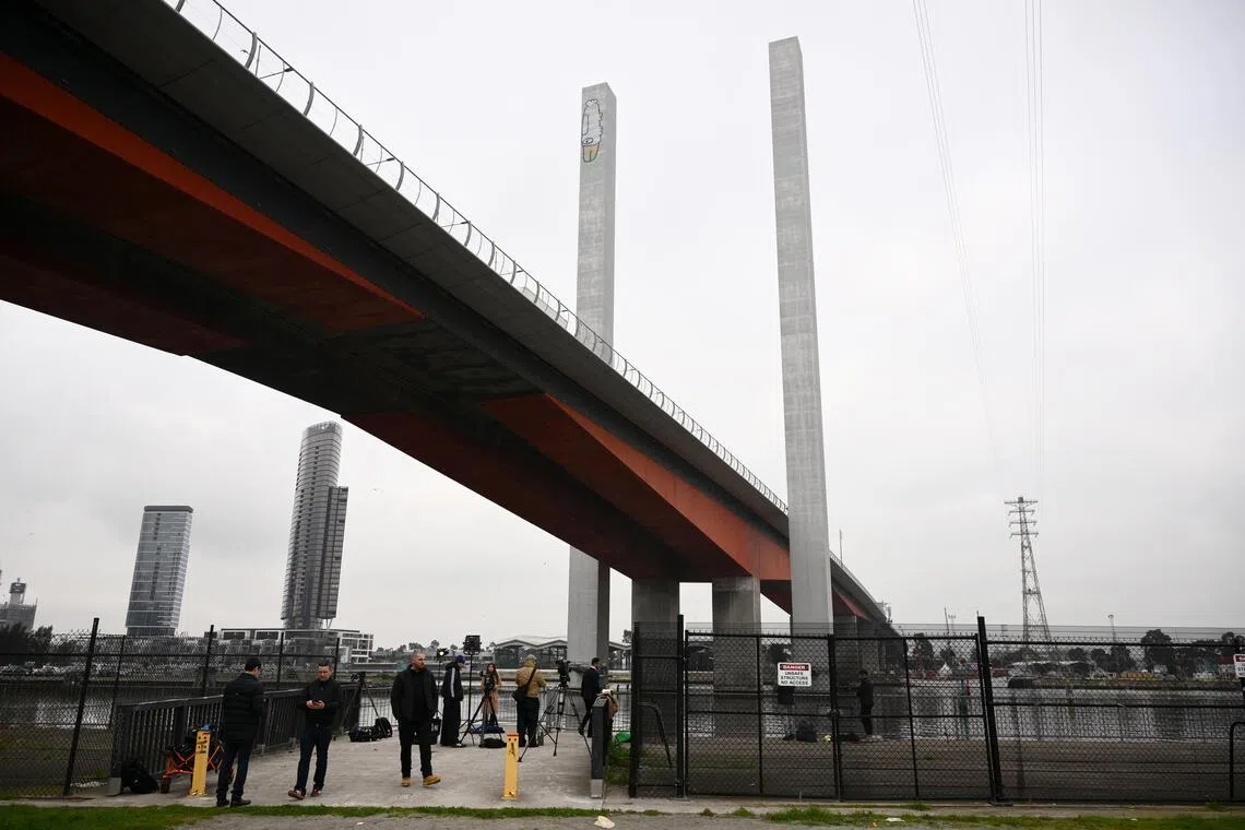 The man demanded a peanut butter sandwich be delivered by drone before he would come down, causing a stand-off with police and closing a lane on the Bolte Bridge.
