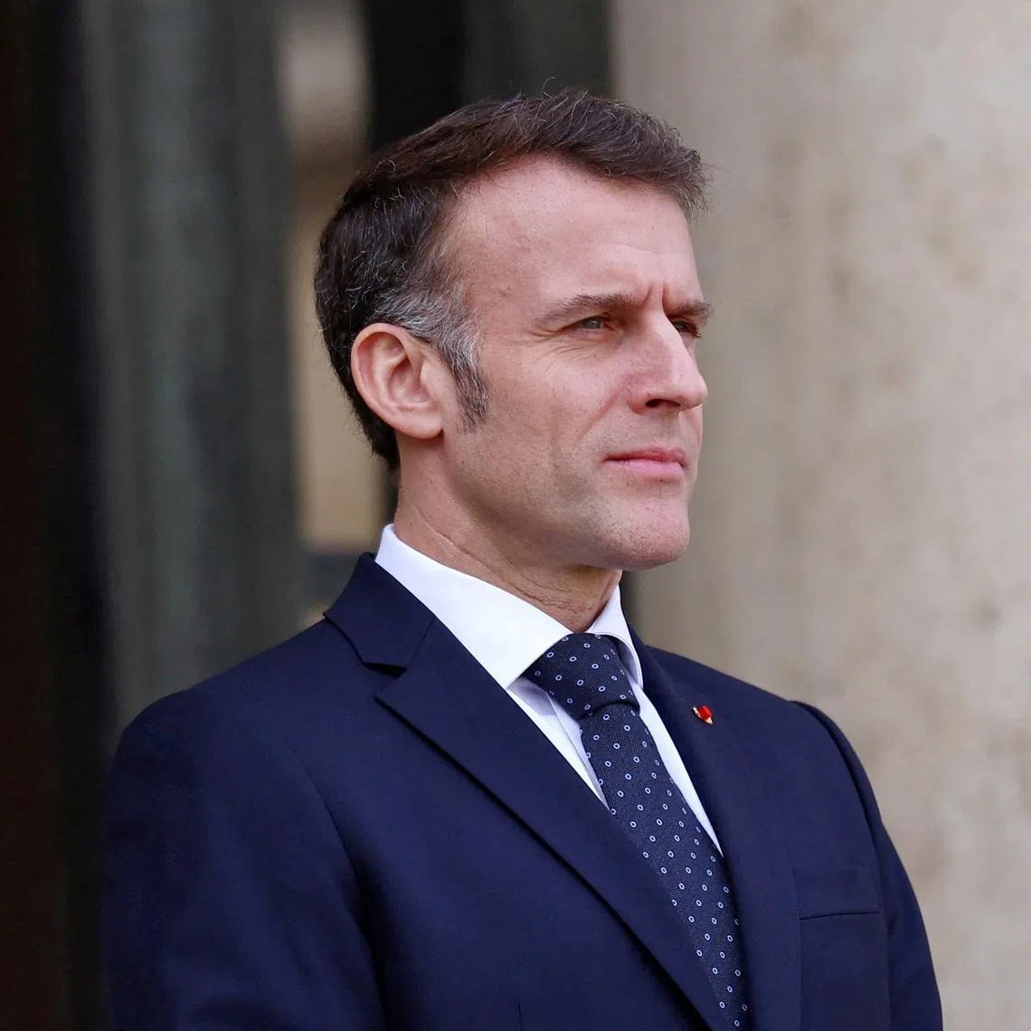 FILE PHOTO: French President Emmanuel Macron waits for the arrival of a guest at the Elysee Palace in Paris, France, February 23, 2026. REUTERS/Abdul Saboor/File Photo