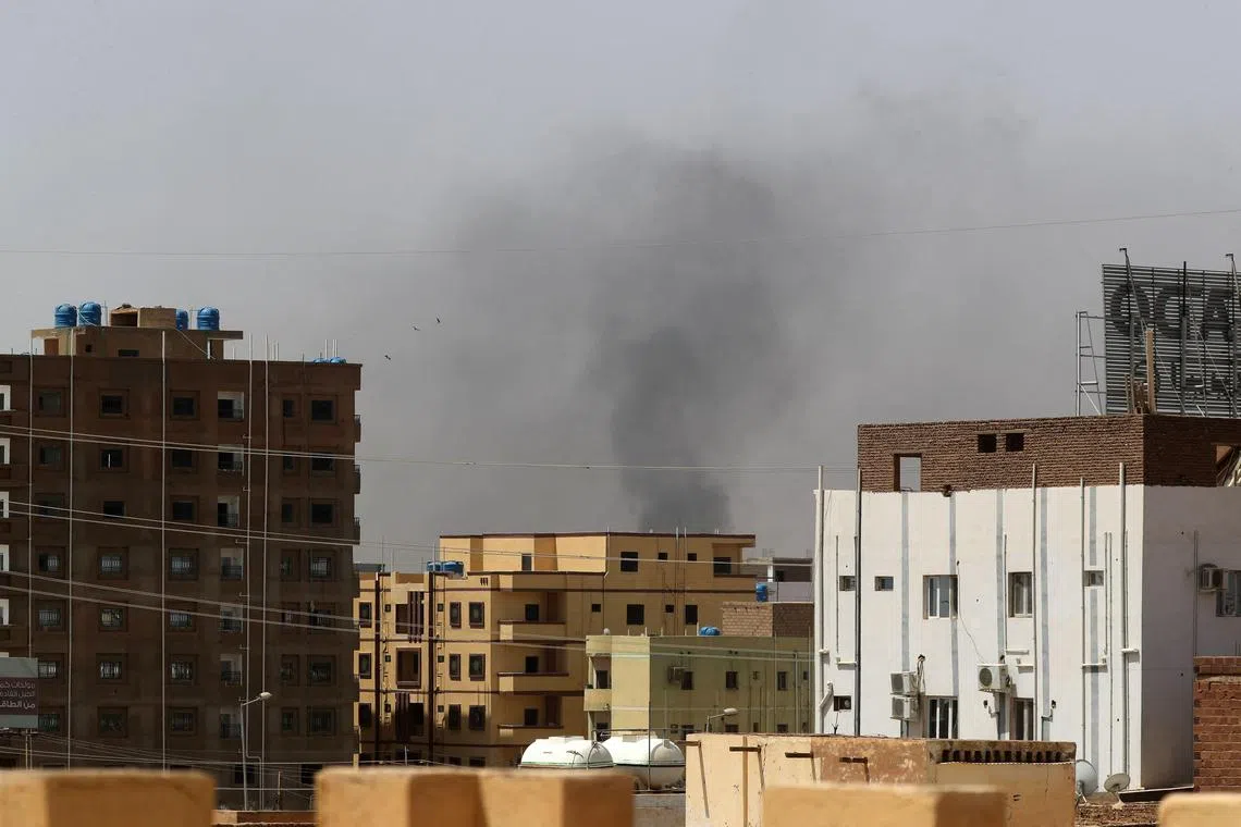 Smoke rises above buildings in Khartoum on April 15, 2023, amid reported clashes in the city.