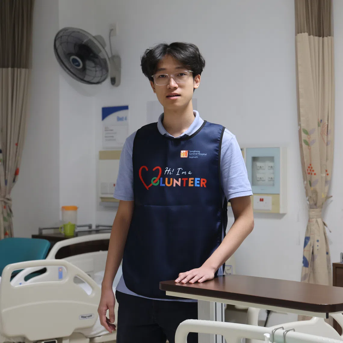 Singapore Polytechnic student Justin Tan is a volunteer for Sengkang General Hospital's Night Watchers programme, which supports the hospital during the graveyard shift.