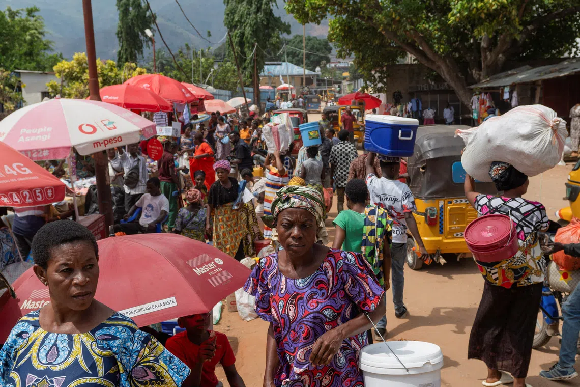 Congolese civilians walk at Maendeleo market as calm returns after clashes between members of the Alliance Fleuve Congo (AFC) and the M23 Movement, who took control of Uvira from the Armed Forces of the Democratic Republic of the Congo (FARDC), in Uvira on the shores of Lake Tanganyika, South Kivu province, Democratic Republic of the Congo, December 15, 2025. REUTERS/Stringer/File Photo