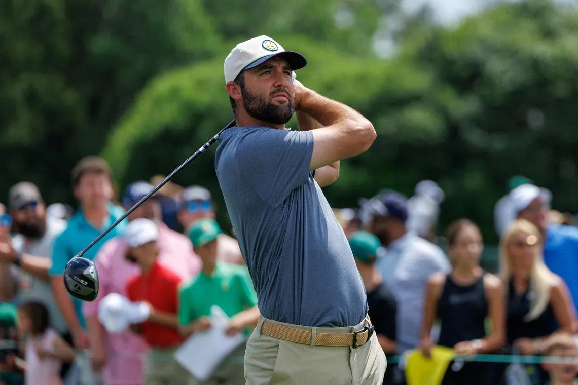 Masters champion Scottie Scheffler hits off the first tee as he starts a practice round at the Augusta National Golf Club in Augusta, Georgia, U.S., April 6, 2025. REUTERS/Mike Blake