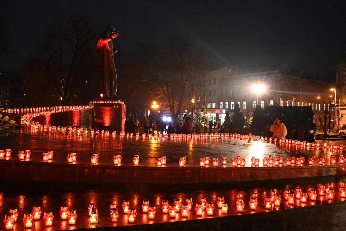 Residents commemorating the victims of the Holodomor, Ukrainian for "death by starvation", in Lviv, Ukraine, on Nov 26.