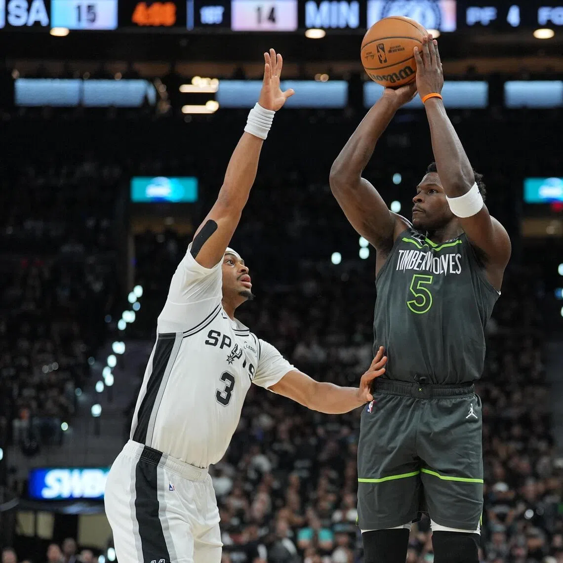Minnesota Timberwolves star Anthony Edwards shooting over Keldon Johnson of the San Antonio Spurs during the Spurs' 133-95 home win in their NBA play-off series on May 6.