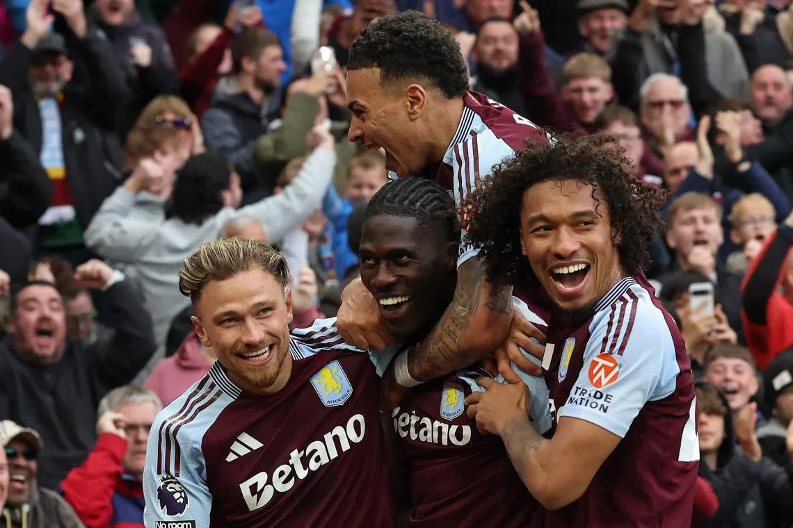 Aston Villa's Amadou Onana (centre) celebrates scoring the team's fourth goal.