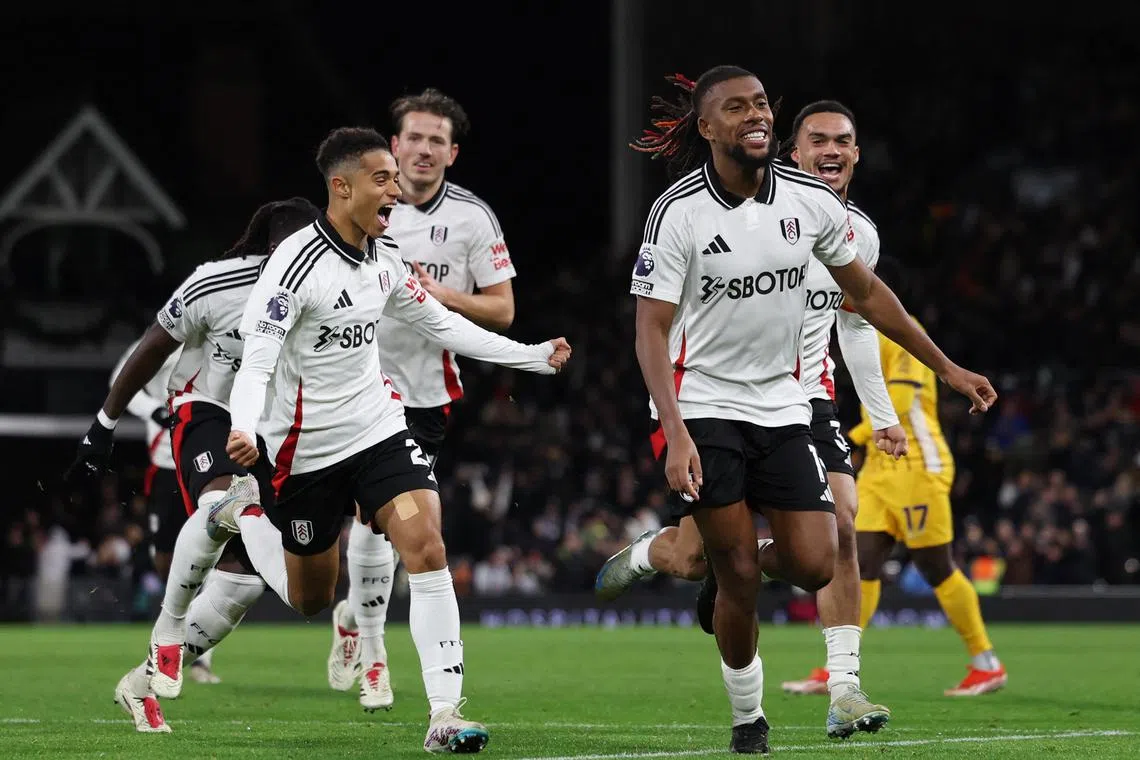 Fulham's Alex Iwobi celebrates scoring their third goal in the 3-1 Premier League win over Brighton & Hove Albion.