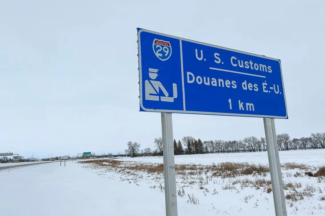 FILE PHOTO: Snow covers the ground around a sign near the Emerson-Pembina crossing at the Canada-US border in Emerson, Manitoba, Canada January 9, 2025. REUTERS/Ed White/File Photo
