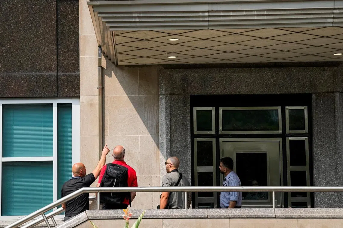 Investigators working at the scene of a shooting at the US consulate in Toronto, Canada, on July 27.