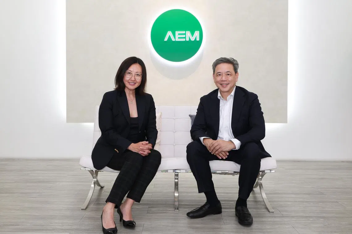 Ms Amy Leong (left) with AEM chairman Loke Wai San.  Ms Leong will continue as a senior adviser to the company to assist with the transition.