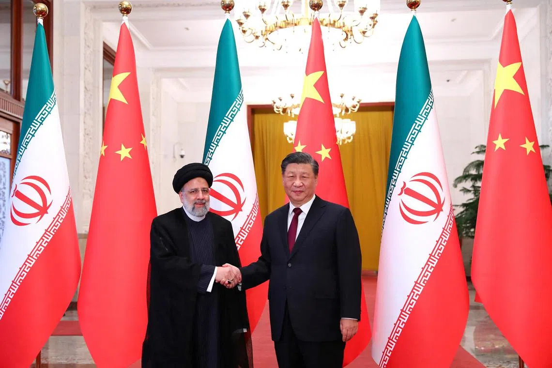 Iranian President Ebrahim Raisi shakes hands with Chinese President Xi Jinping during a welcoming ceremony in Beijing, China on Feb 14, 2023. 