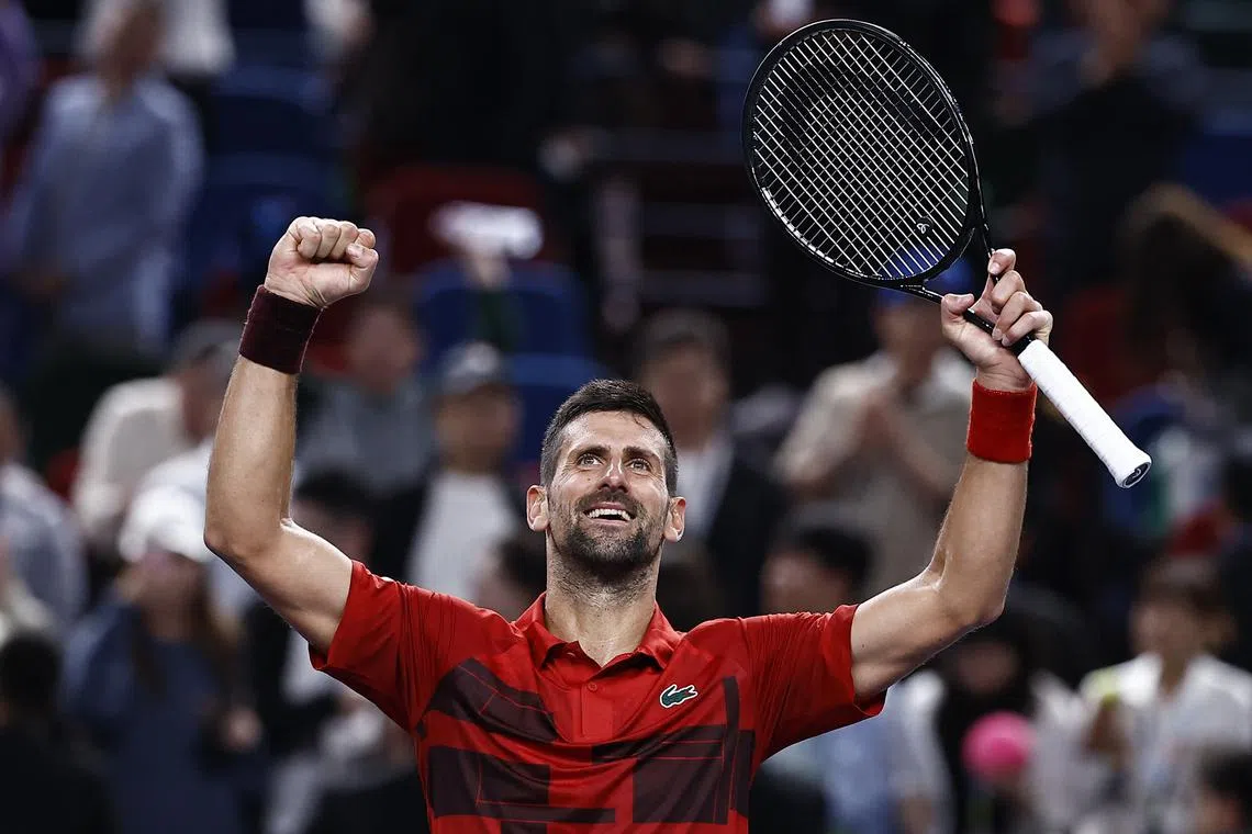 Tennis - Shanghai Masters - Qizhong Forest Sports City Arena, Shanghai, China - October 12, 2024 Serbia's Novak Djokovic celebrates after winning his semi final match against Taylor Fritz of the U.S. REUTERS/Tingshu Wang