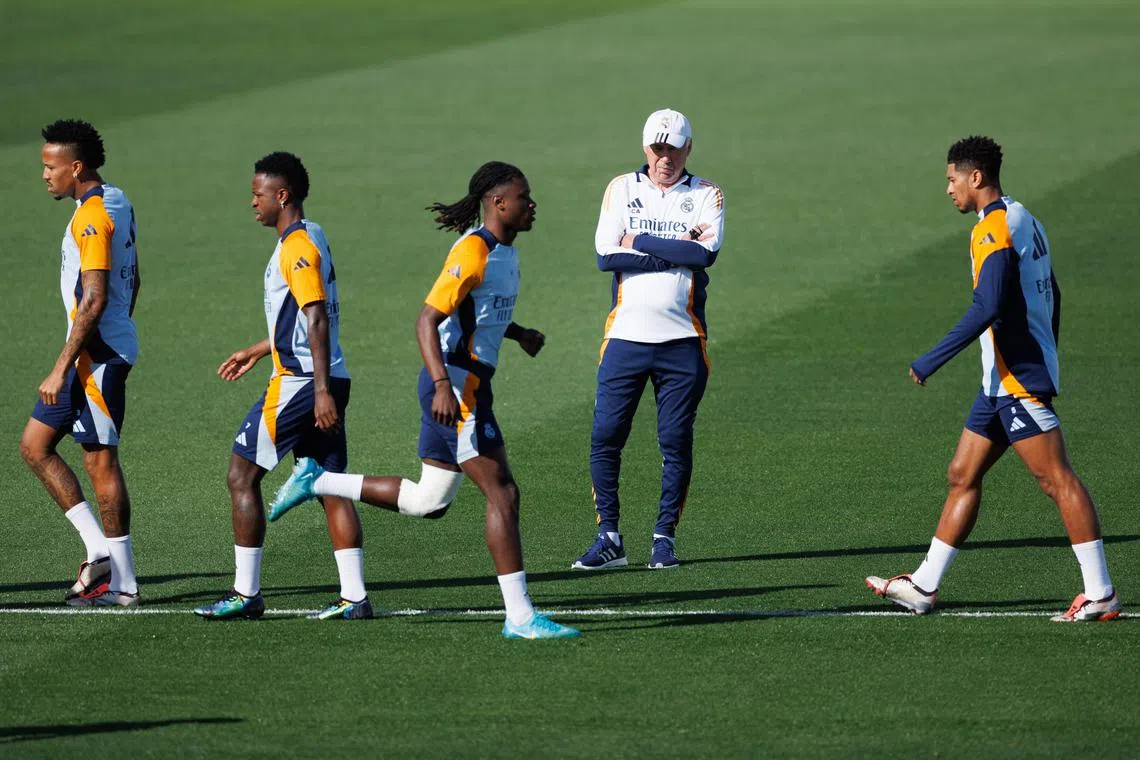 Real Madrid head coach Carlo Ancelotti (second from right) attending a team training session in Madrid, on Oct 4.