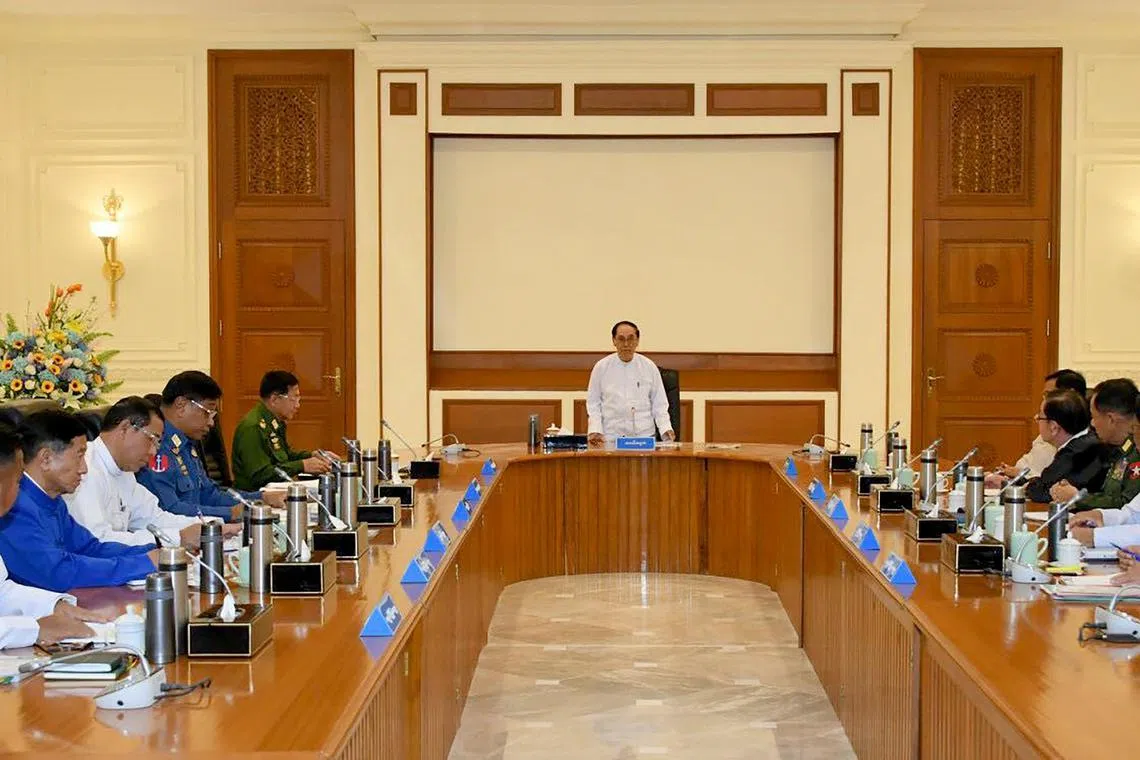A handout photo shows Myanmar acting president Myint Swe presiding over a defence and national security meeting.