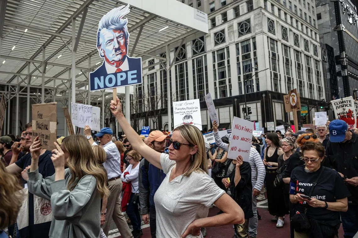 Protesters marching against the Trump administration in New York City, on April 19.